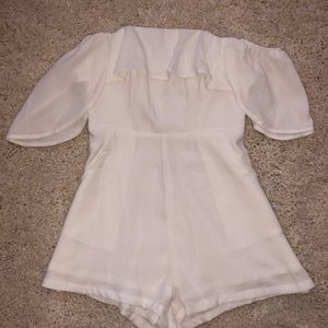 Brand new white play suit from Polly